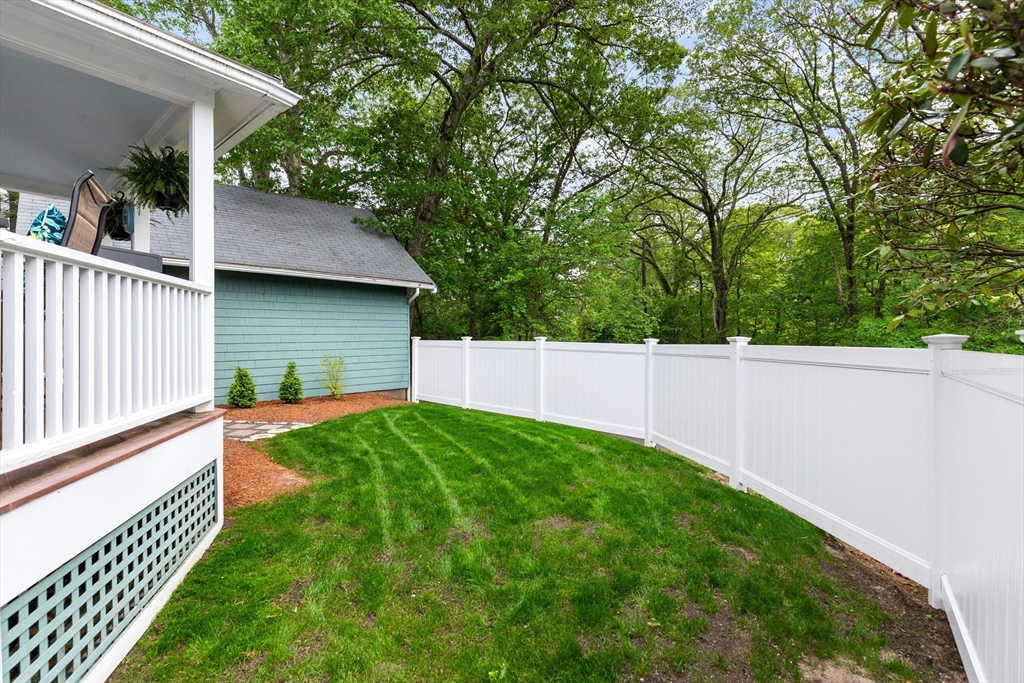 500 Lowell Street Lexington, MA 02420 - Photo 18 of 25 a view of backyard with green space