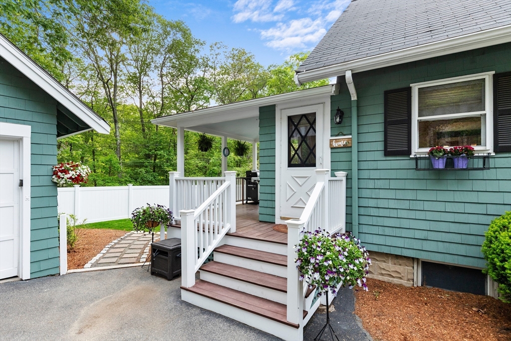 500 Lowell Street Lexington, MA 02420 - Photo 20 of 25 a view of a house with backyard and sitting area