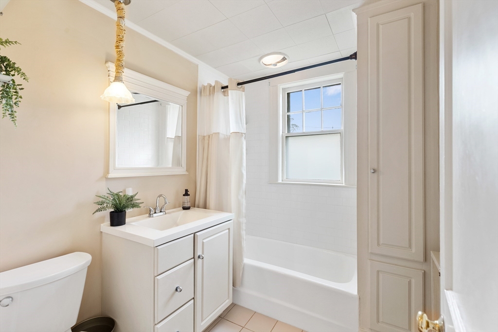 500 Lowell Street Lexington, MA 02420 - Photo 8 of 25 a bathroom with a sink a toilet and shower