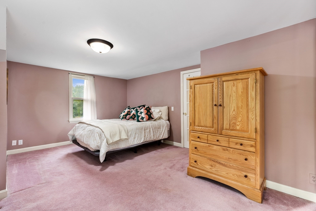 500 Lowell Street Lexington, MA 02420 - Photo 10 of 25 a bed room with a bed and a window