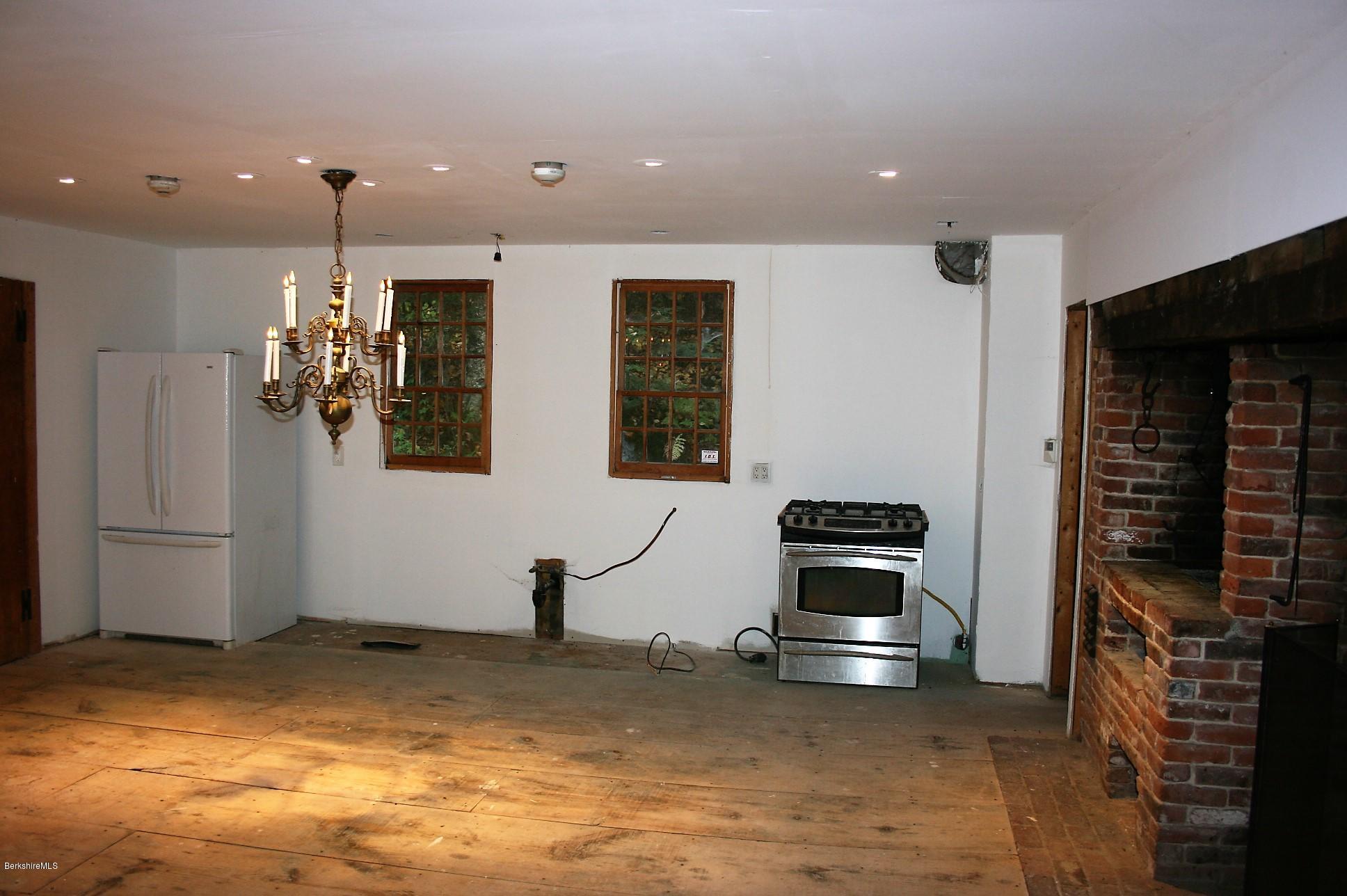 117 East River Road Middlefield, MA 01050 - Photo 15 of 20 a kitchen with stainless steel appliances kitchen island granite countertop a stove and a refrigerator