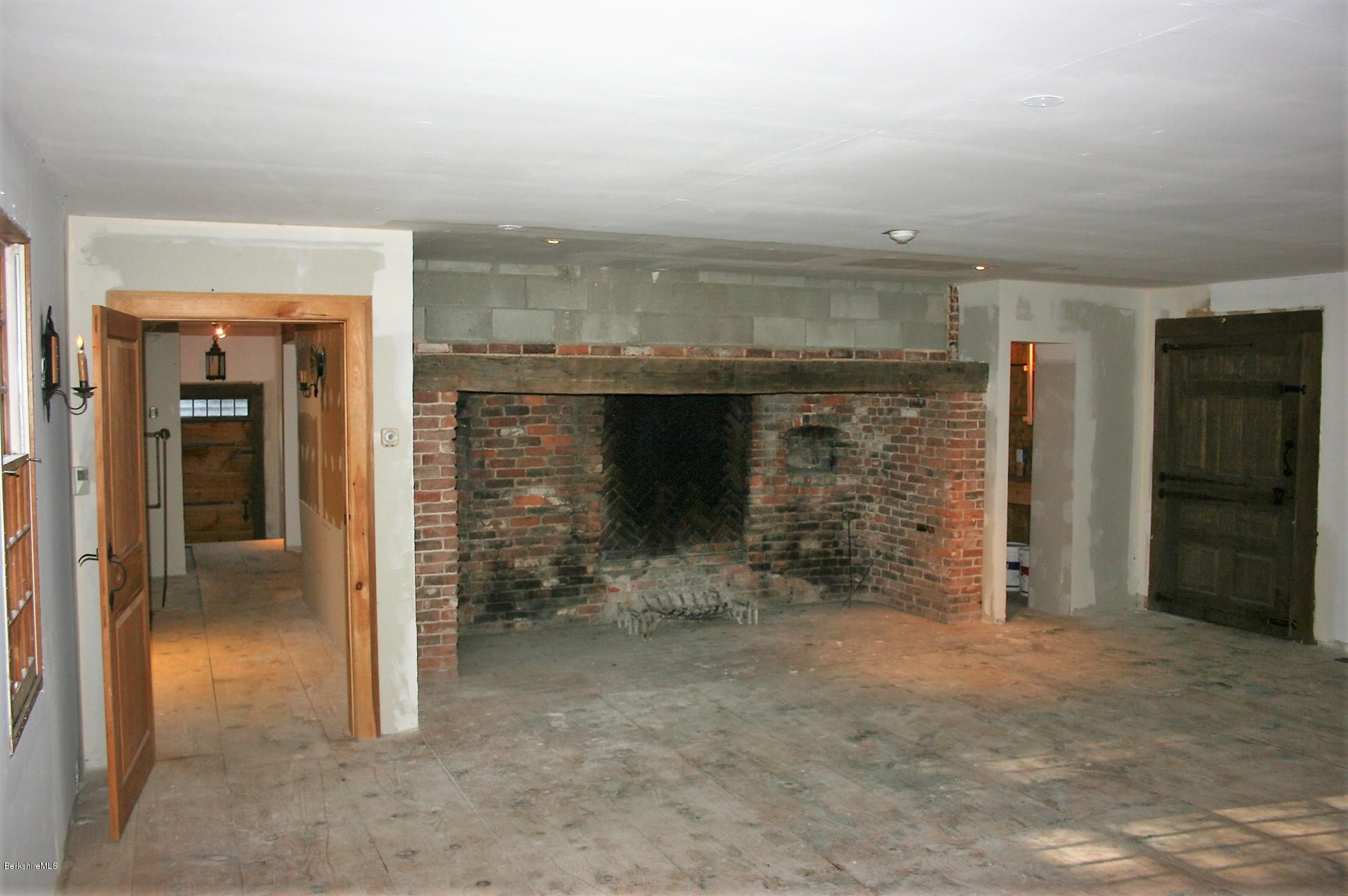 117 East River Road Middlefield, MA 01050 - Photo 16 of 20 an empty room with fireplace