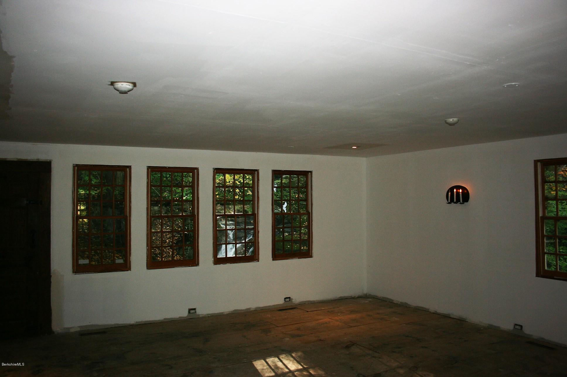 117 East River Road Middlefield, MA 01050 - Photo 17 of 20 wooden floor in an empty room with a window