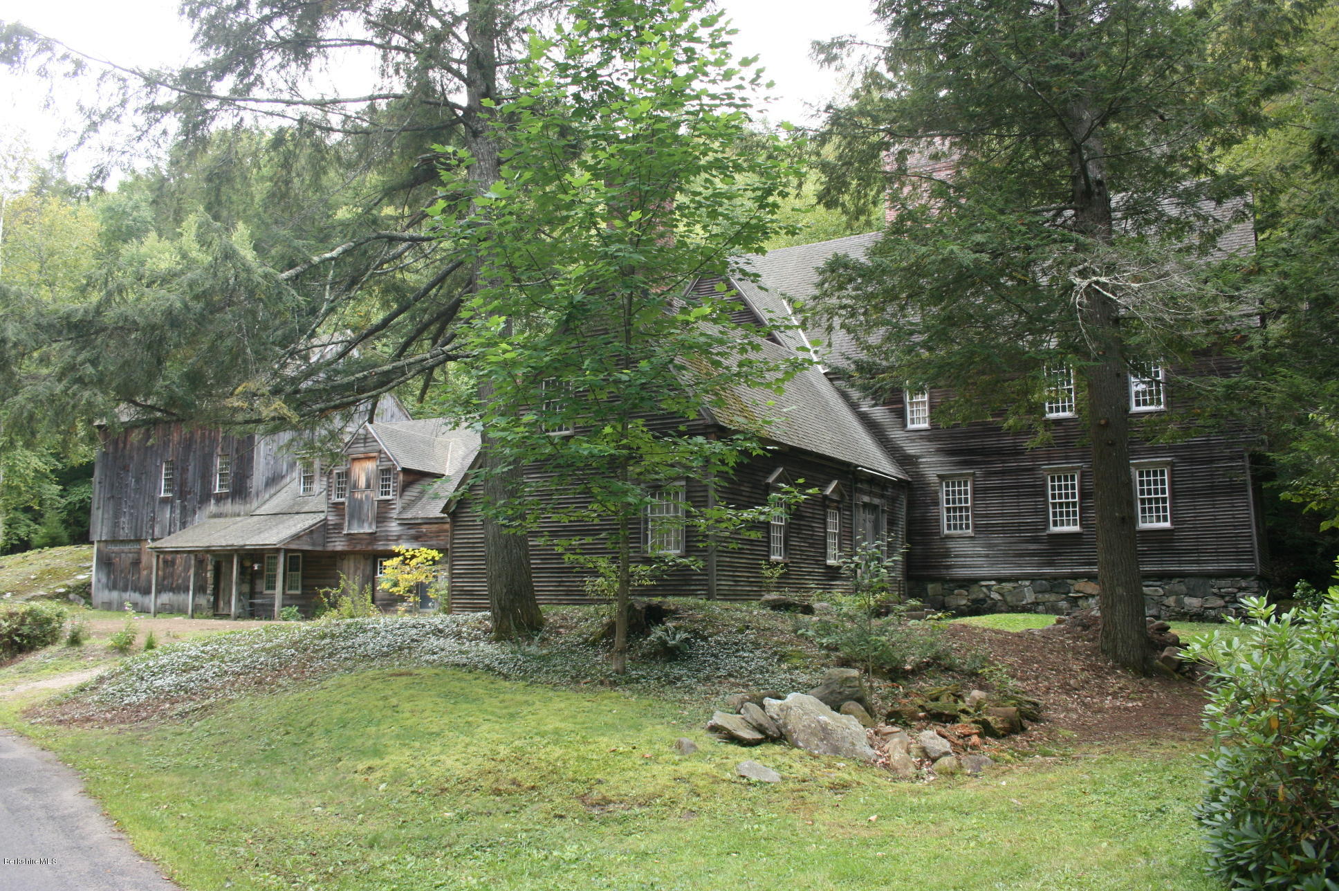 117 East River Road Middlefield, MA 01050 - Photo 5 of 20 a backyard of a house with table and chairs