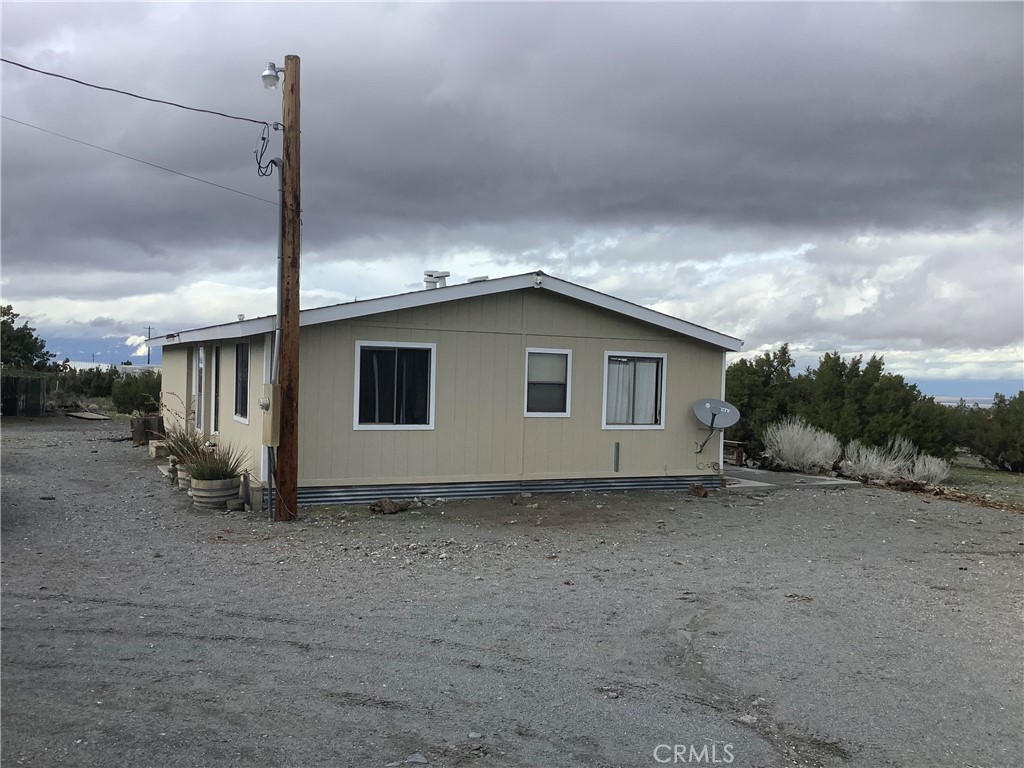 2830 Phelan Road Phelan, CA 92371 - Photo 9 of 10 a view of a house with a backyard