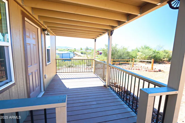 a view of a deck with wooden floor and outdoor space