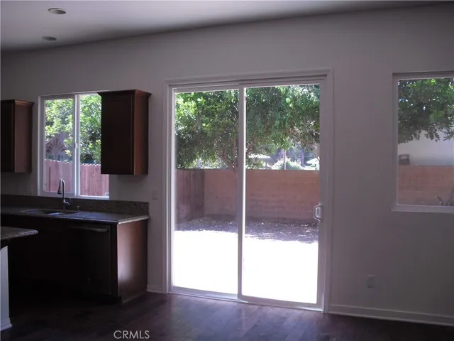a kitchen with a window a sink and a counter top space