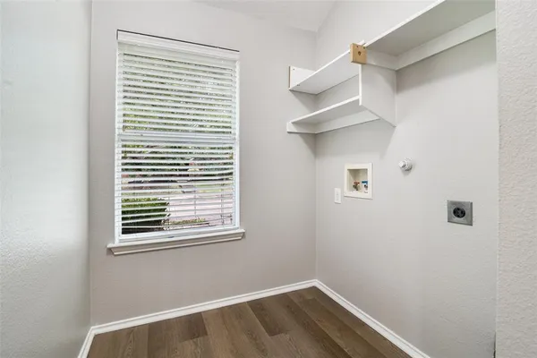 a view of a livingroom with a fireplace a sink and a kitchen