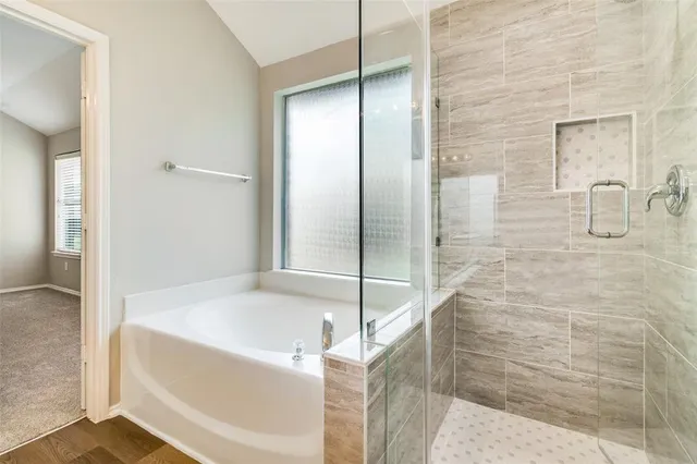 a view of empty room with ceiling fan