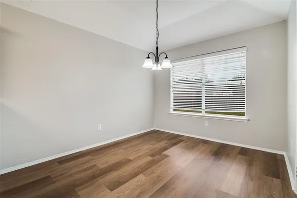 a bathroom with a sink a toilet a shower and a mirror