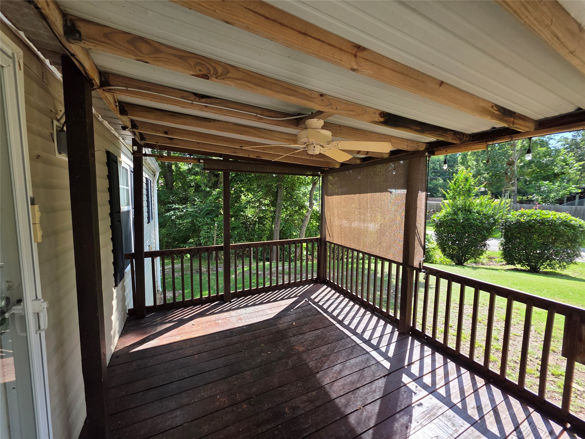 70 Montego Way Point Blank, TX 77364 - Photo 39 of 41 a view of a porch with wooden floor in front of a house