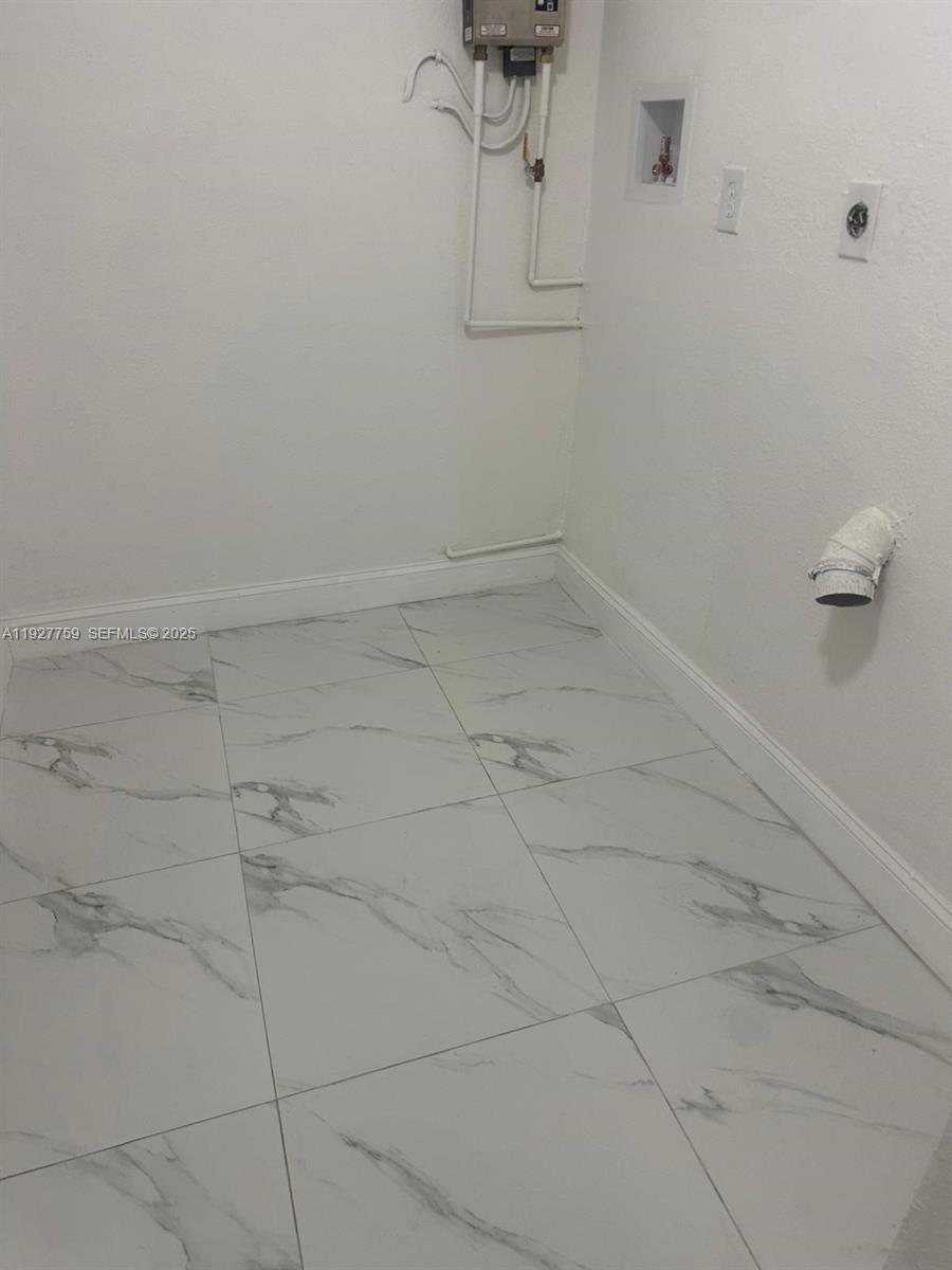 6750 Allen Street Hollywood, FL 33024 - Photo 29 of 79 a view of a room with rack on the wall