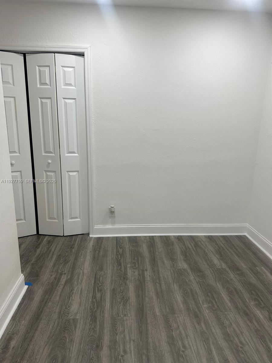 6750 Allen Street Hollywood, FL 33024 - Photo 38 of 79 a view of an empty room with wooden floor and a window