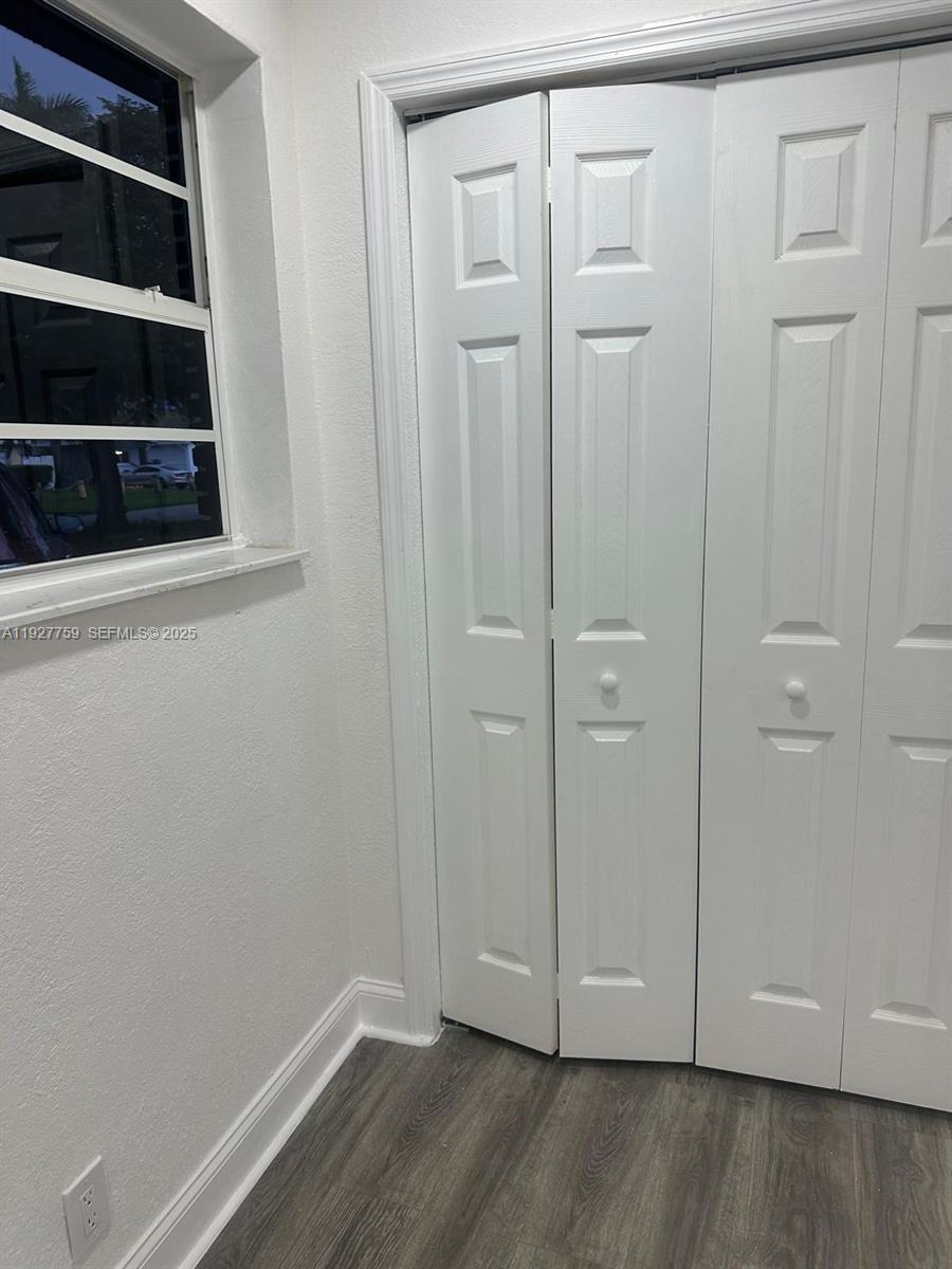 6750 Allen Street Hollywood, FL 33024 - Photo 43 of 79 a view of an empty room with wooden floor and closet