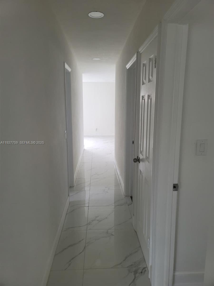 6750 Allen Street Hollywood, FL 33024 - Photo 57 of 79 a view of hallway with an empty space