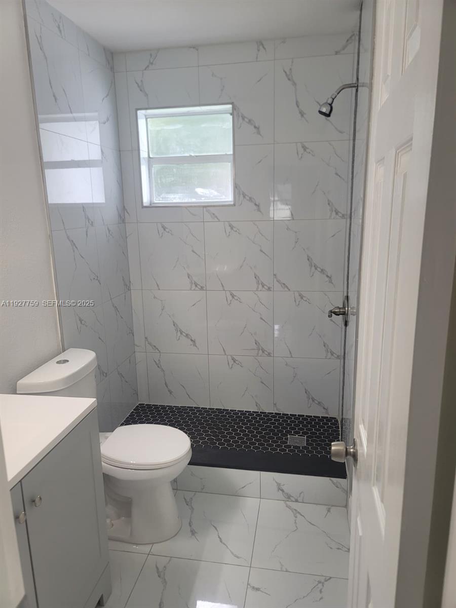 6750 Allen Street Hollywood, FL 33024 - Photo 58 of 79 a bathroom with a toilet and a shower