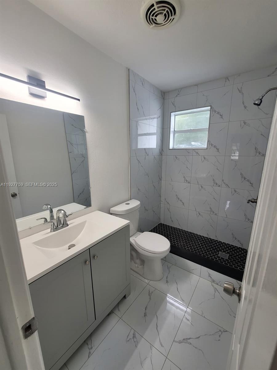 6750 Allen Street Hollywood, FL 33024 - Photo 59 of 79 a bathroom with a sink a toilet and shower