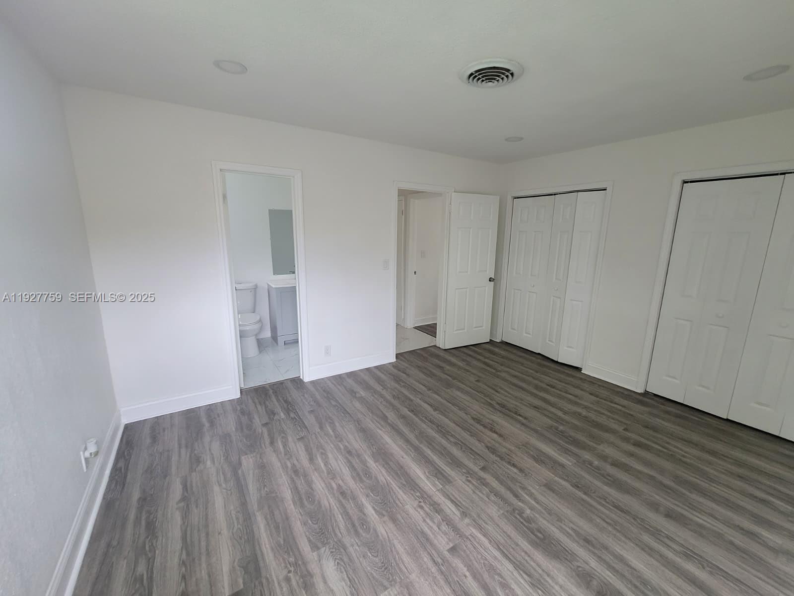 6750 Allen Street Hollywood, FL 33024 - Photo 66 of 79 a view of a room with wooden floor and white walls