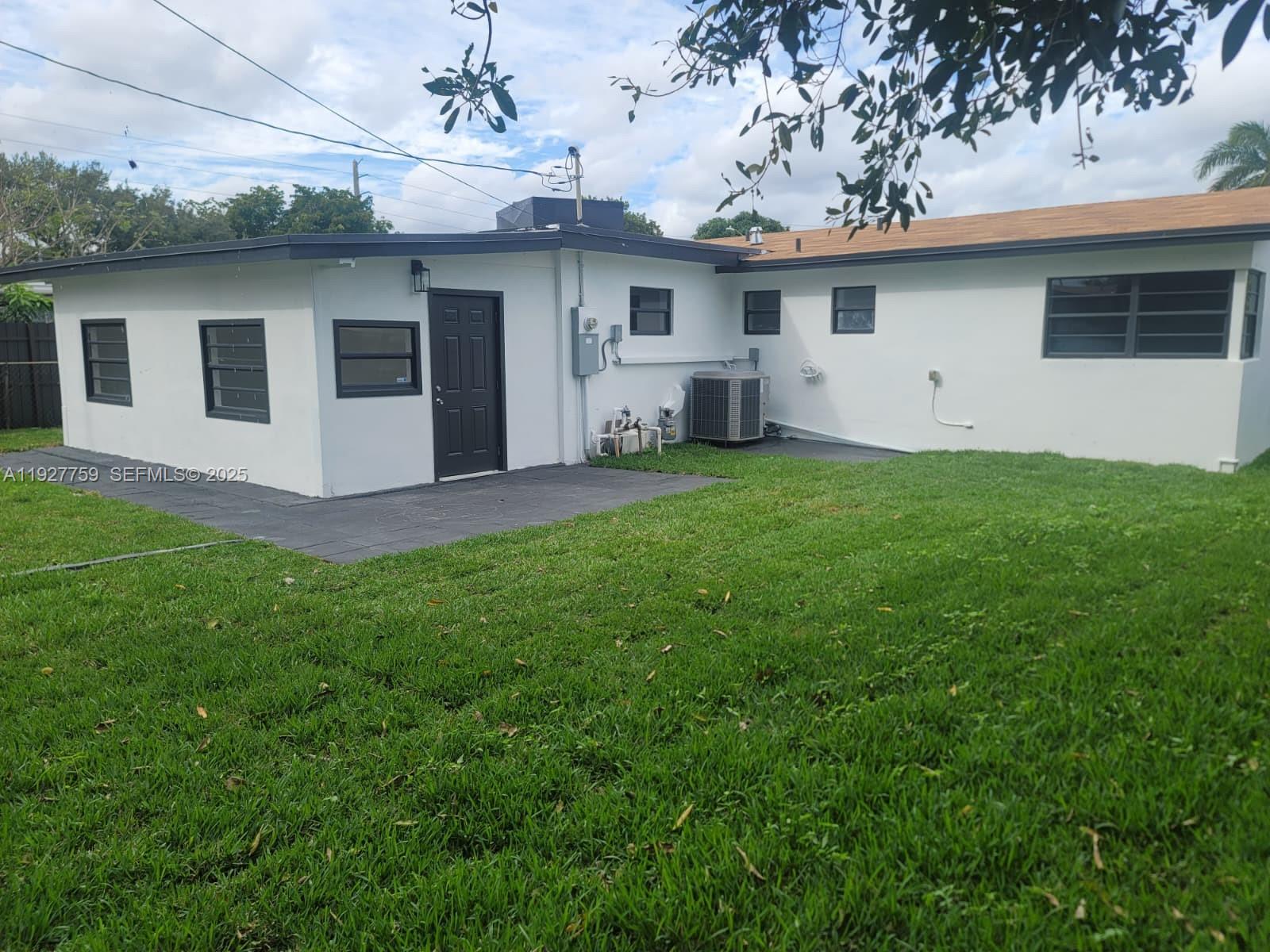 6750 Allen Street Hollywood, FL 33024 - Photo 76 of 79 a view of a backyard with plants and a garden