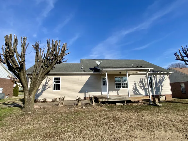 a house with trees in front of it