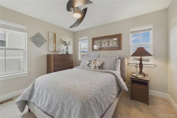 a bedroom with bed and window