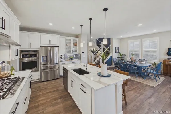 a kitchen that has a lot of cabinets