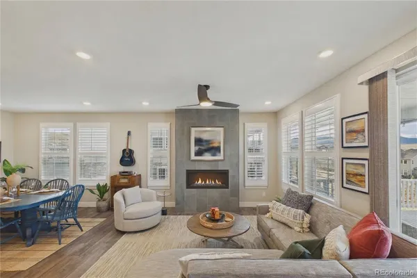 a living room with furniture and fireplace