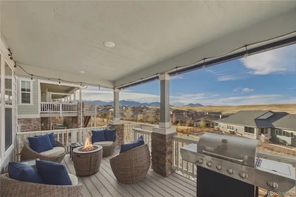 a living room with couch and a floor to ceiling window