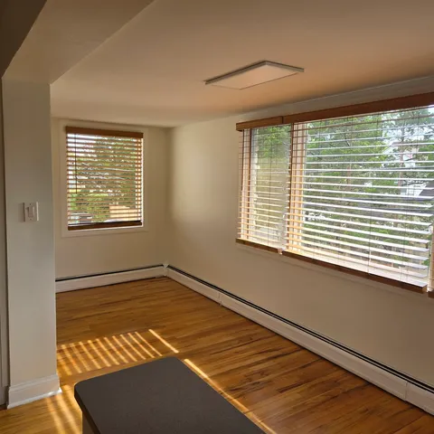 a view of an empty room with a window