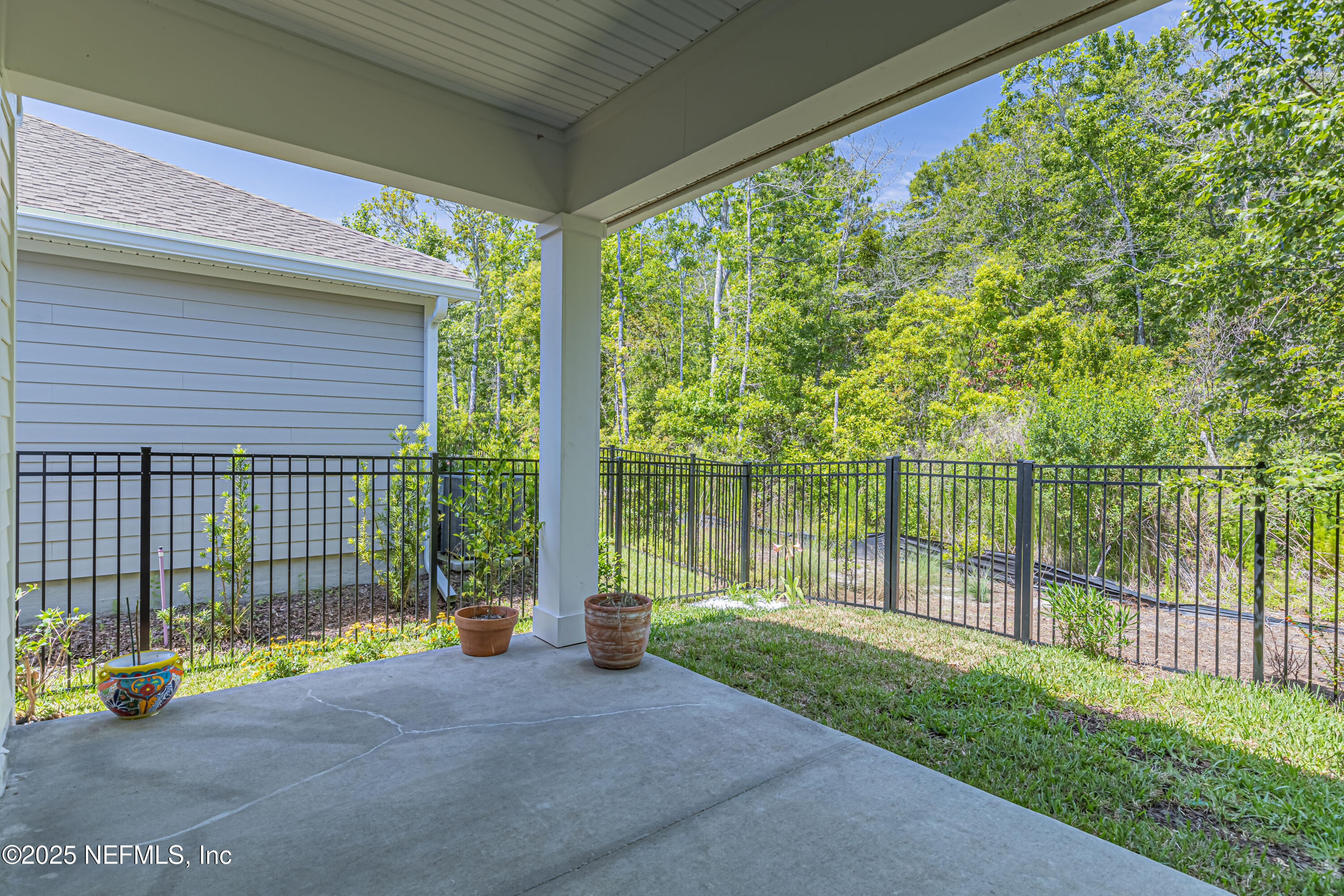 383 Windswept Way Street St. Augustine, FL 32092 - Photo 32 of 34 a view of a backyard with a garden