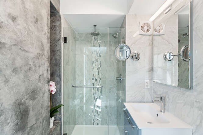 8 Whittier Place, Unit 21E Boston, MA 02114 - Photo 15 of 34 a bathroom with a shower and sink