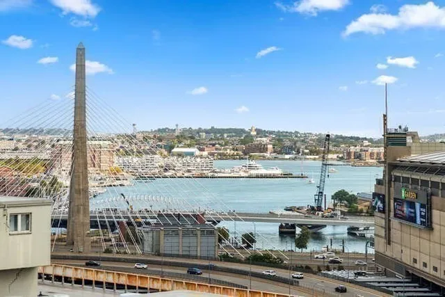 a view of a lake with tall buildings