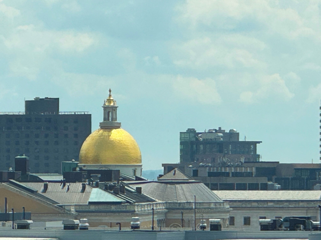 8 Whittier Place, Unit 21E Boston, MA 02114 - Photo 23 of 34 a front view of a house with sitting space