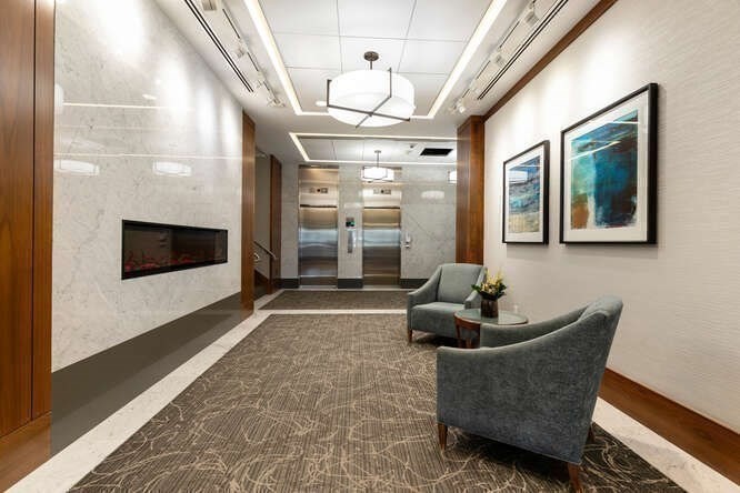 8 Whittier Place, Unit 21E Boston, MA 02114 - Photo 26 of 34 a living room with furniture and a fireplace