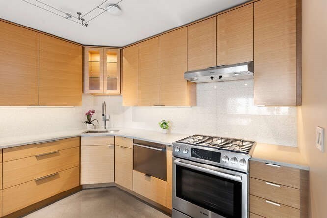 8 Whittier Place, Unit 21E Boston, MA 02114 - Photo 3 of 34 a kitchen with a stove oven and sink