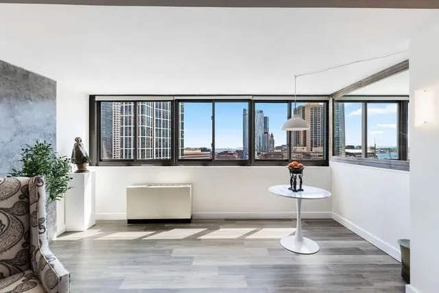 a living room with furniture and a large window