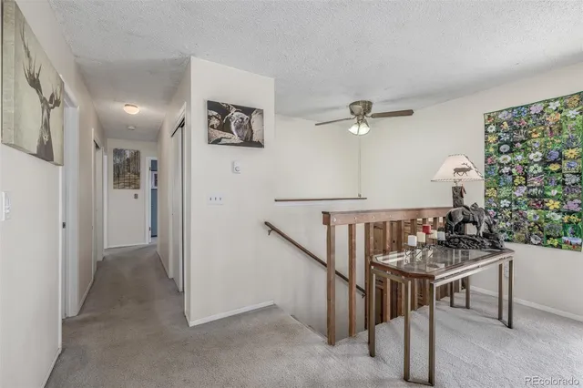 a kitchen with granite countertop appliances a sink and cabinets
