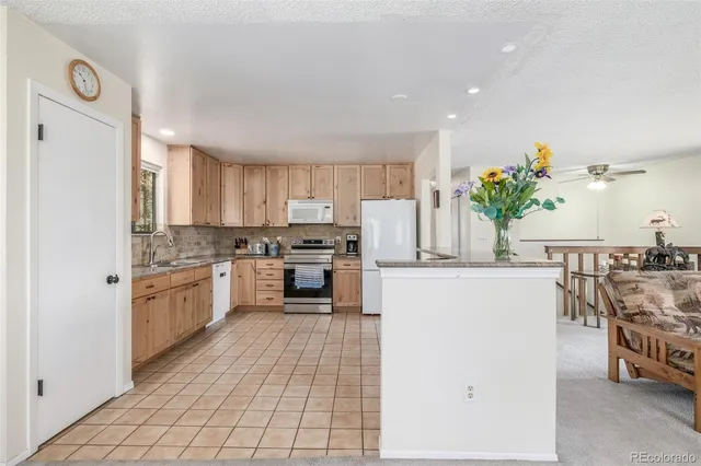 a bedroom with a bed and a lamp on table