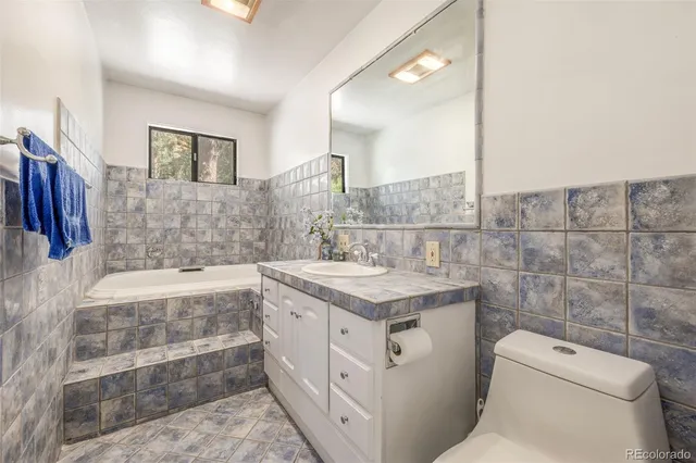 a spacious bedroom with a bed and a window