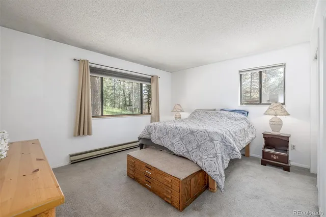 a spacious bedroom with a large bed and a window