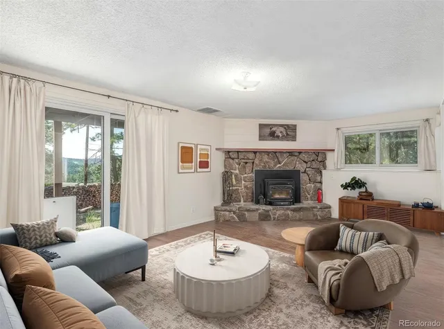 a bathroom with a granite countertop toilet sink and mirror
