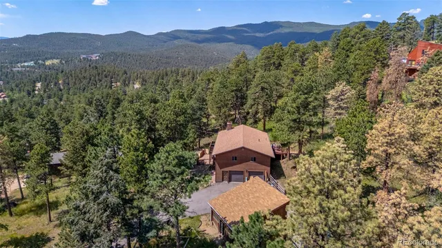 an aerial view of house with yard
