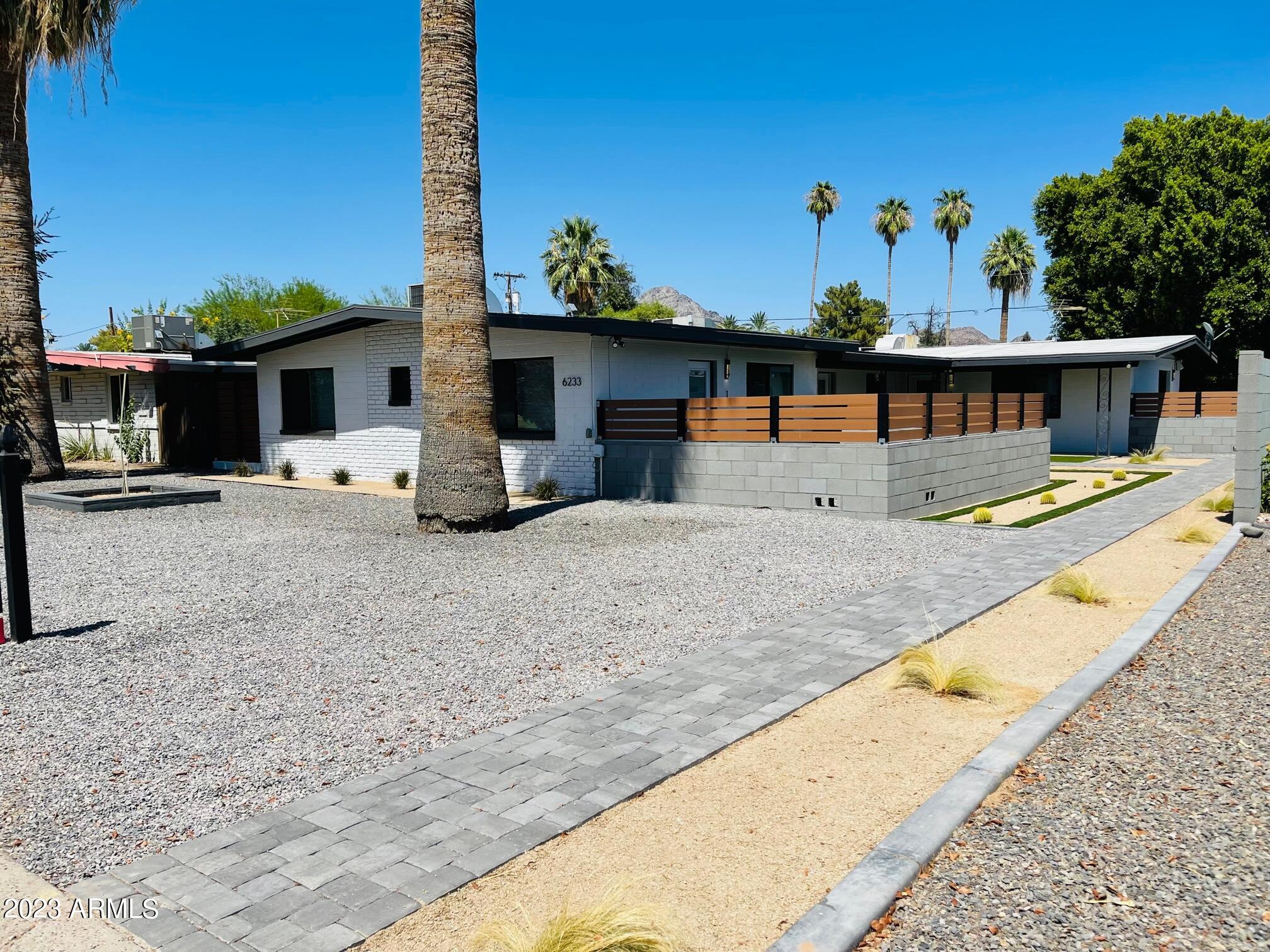 6233 North 13th Place, Unit 1 Phoenix, AZ 85014 - Photo 1 of 20 a view of a terrace with chairs