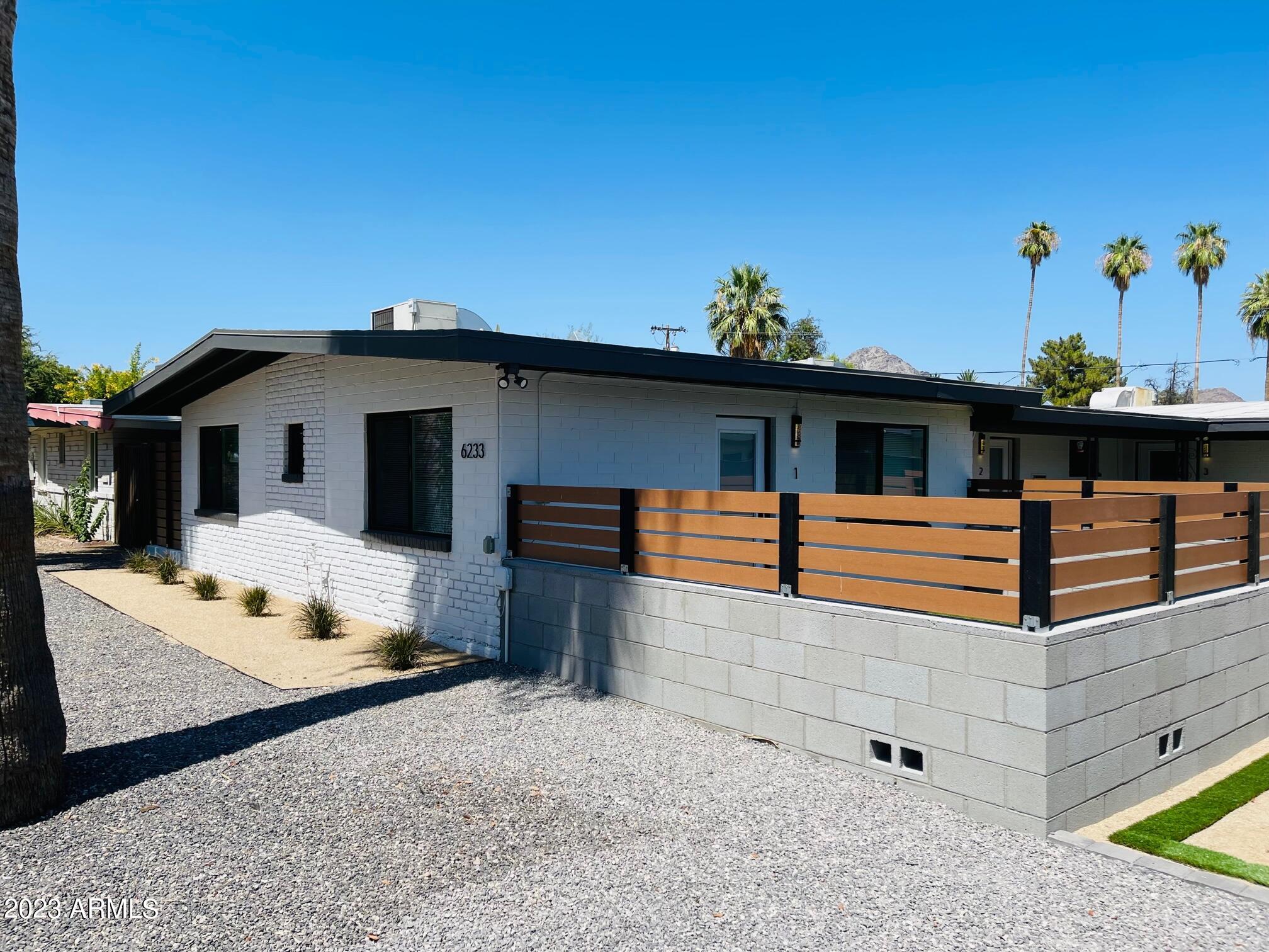 6233 North 13th Place, Unit 1 Phoenix, AZ 85014 - Photo 4 of 20 a front view of a house with garage