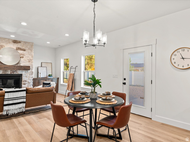 1267 West 2350 South Perry, UT 84302 - Photo 17 of 35 Dining area with wood-finish flooring, featuring a modern chandelier and recessed lighting
