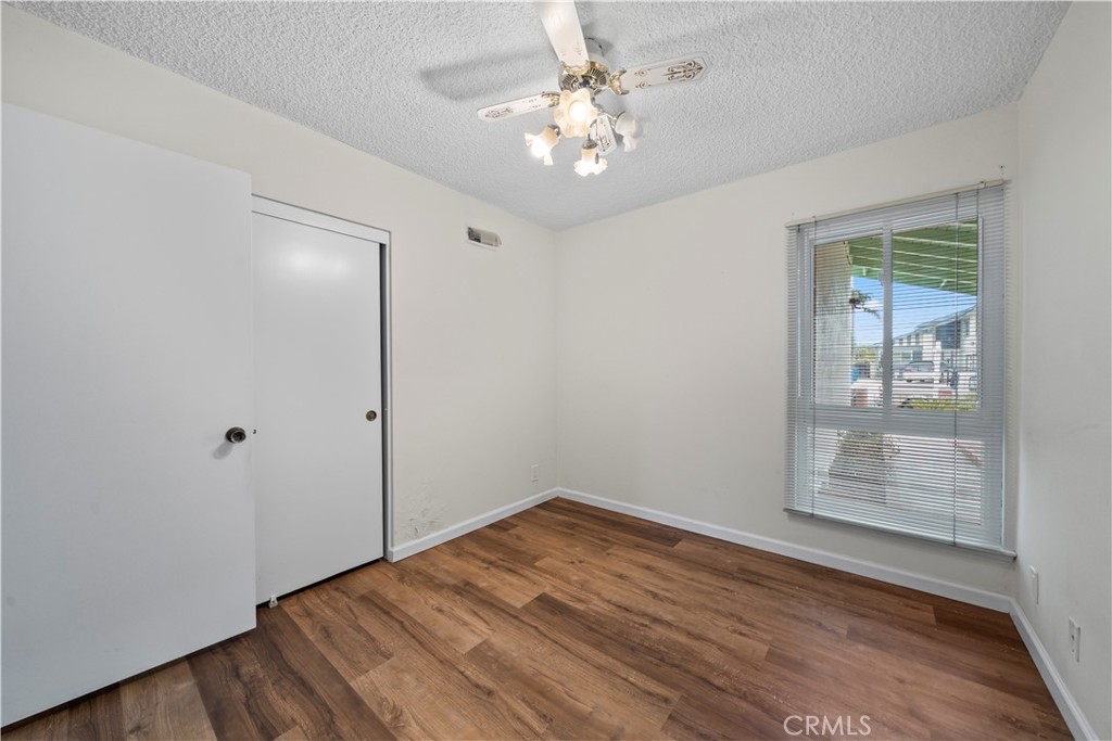 5161 Rotherham Circle Westminster, CA 92683 - Photo 15 of 24 wooden floor in an empty room with a window
