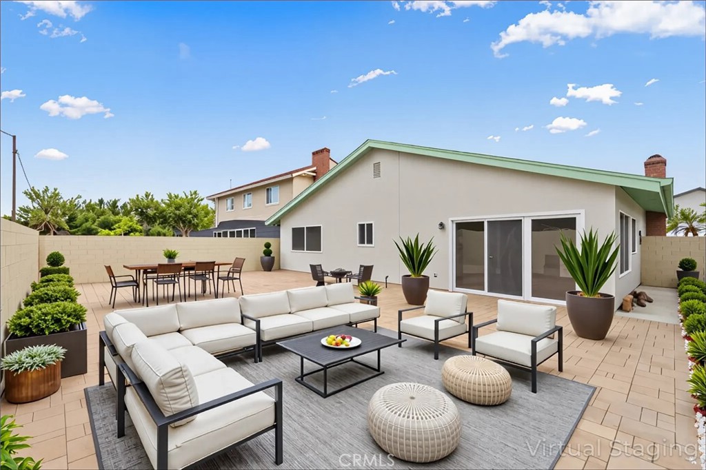 5161 Rotherham Circle Westminster, CA 92683 - Photo 16 of 24 a outdoor living space with furniture and a potted plant