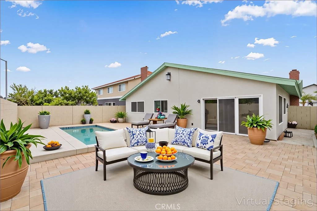 5161 Rotherham Circle Westminster, CA 92683 - Photo 17 of 24 a patio with patio table and chairs