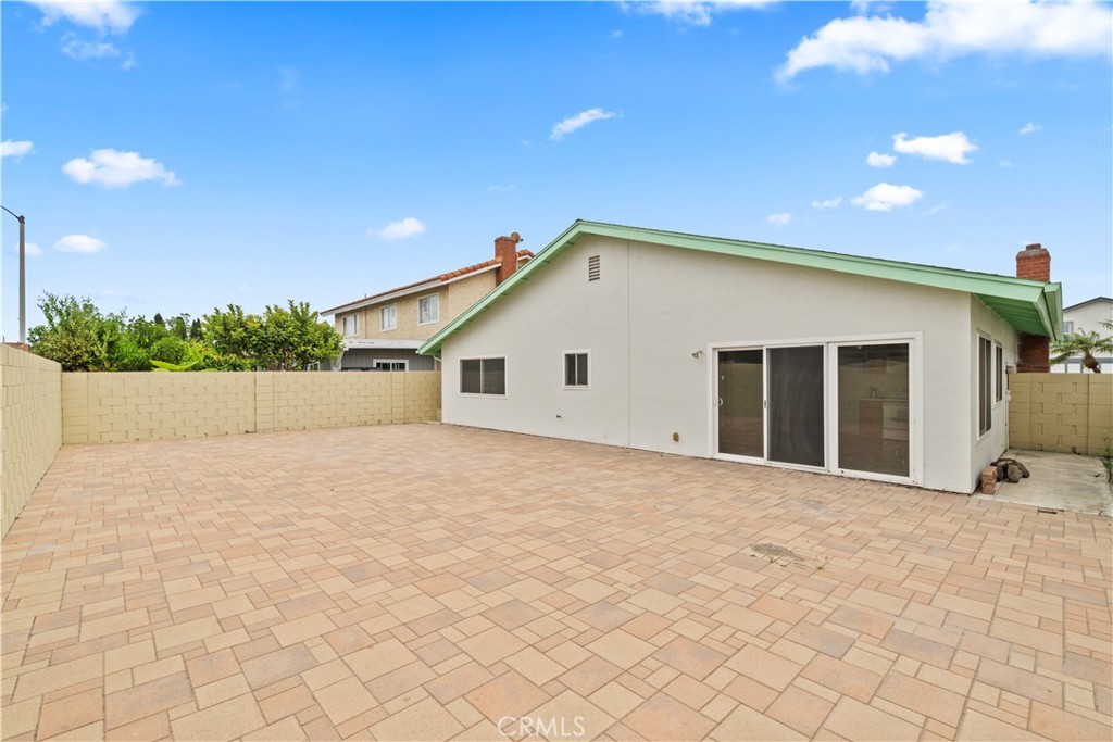 5161 Rotherham Circle Westminster, CA 92683 - Photo 19 of 24 a view of a house with a yard and garage