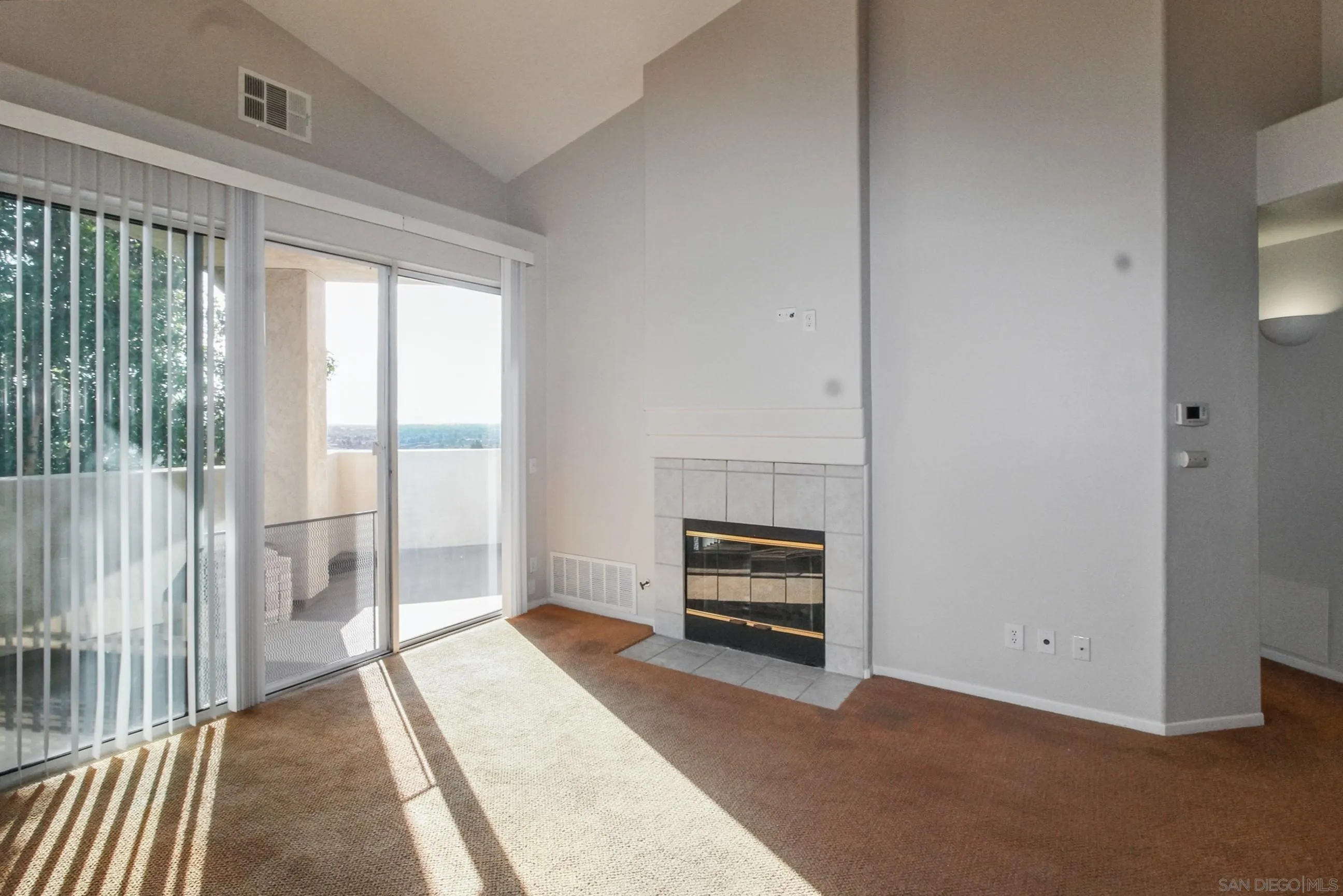 11175 Affinity Court, Unit 45 San Diego, CA 92131 - Photo 17 of 36 a view of a bedroom with furniture wooden floor and window